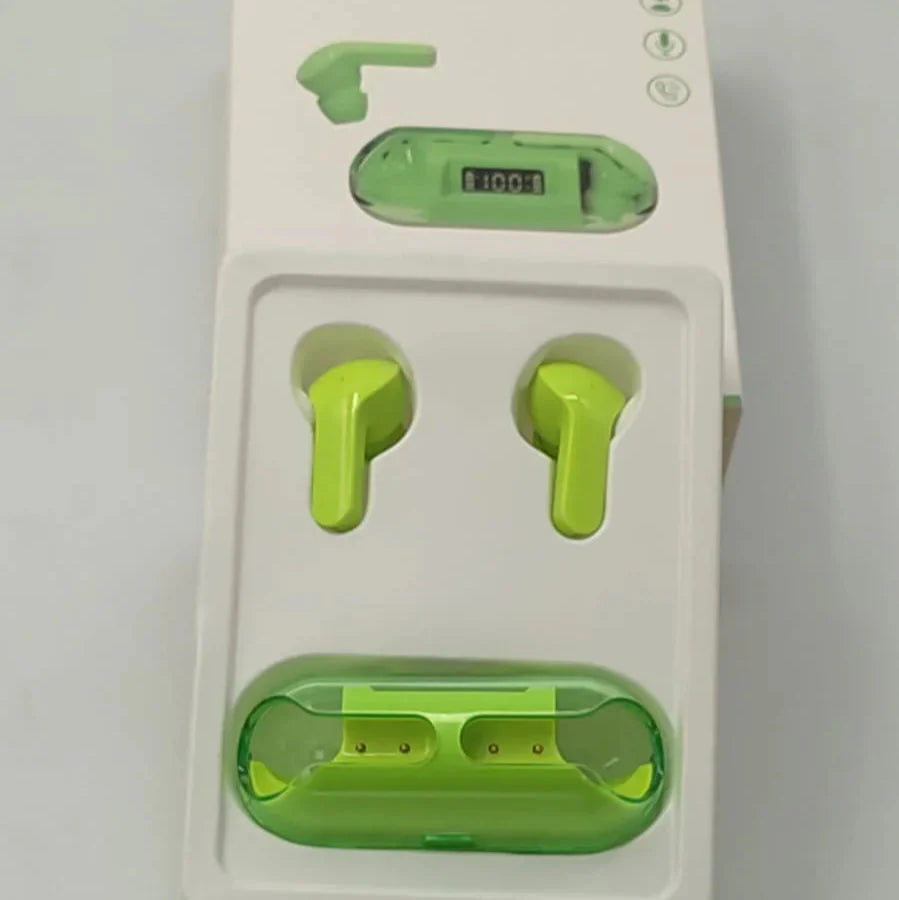 Green earbuds in a white packaging with a USB cable on a gray background